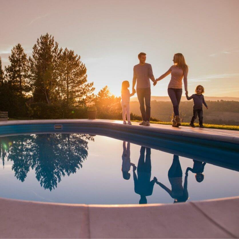 A family enjoying their home pool